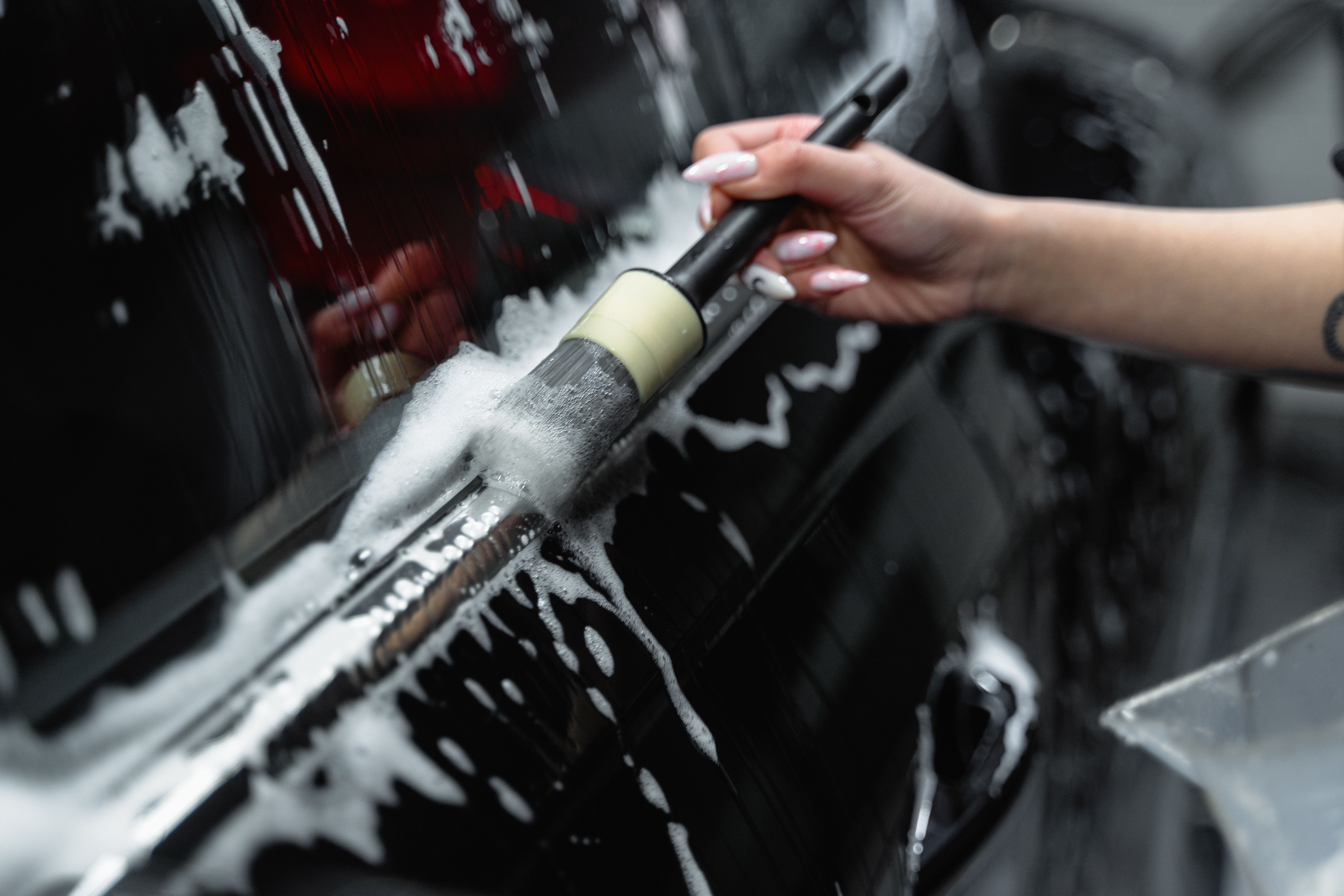 Foam brush cleaning on a vehicle exterior